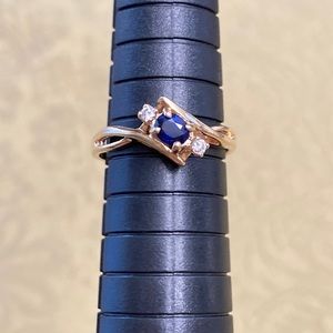 COPY - This is a pretty, genuine sapphire and diamond ring set in 10K gold.